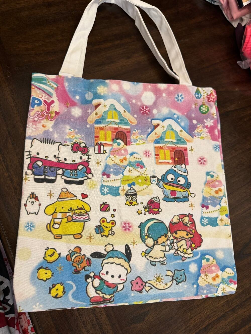 Hello Kitty & friends winter wonderland canvas tote bag in a snowy village scene